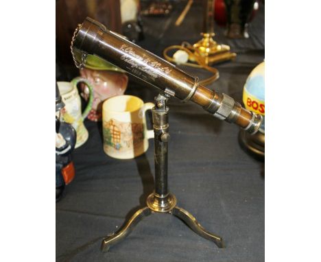Brass telescope on tripod feet