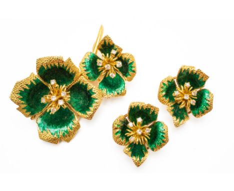 AN 18CT GOLD DIAMOND AND GREEN ENAMELLED BROOCH WITH A MATCHING PAIR OF EARCLIPS (3)The brooch designed as two flowerheads, w