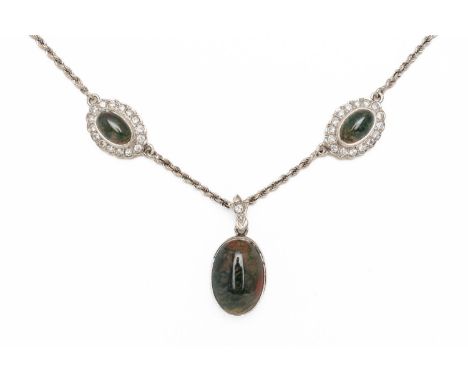 A MOSS AGATE AND DIAMOND NECKLACEThe central oval cabochon moss agate bezel set and suspended from a diamond set bale, on a t