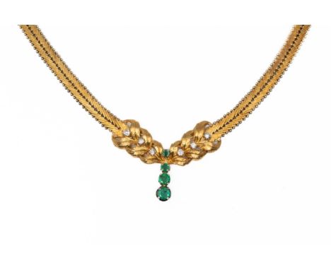A EMERALD AND DIAMOND HEAVY COLLAR NECKLACE (2)The central foliate motif set with round cut emeralds and round brilliant cut 