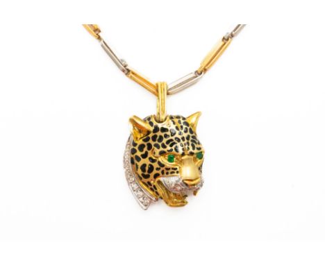 A DOUBLE SIDED PANTHER/JAGUAR PENDANTSet with ruby and emerald eyes and a diamond neck and jowls, stamped for 14ct, weight 12