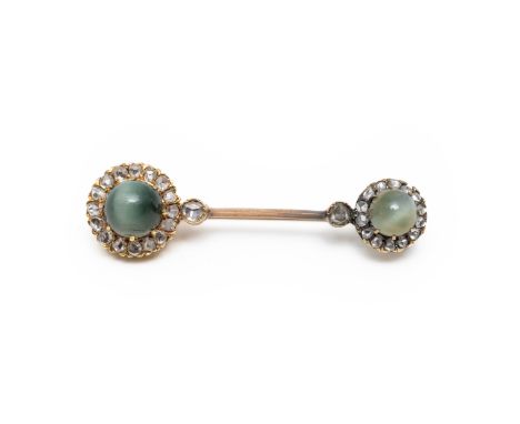 A CAT'S EYE CHRYSOBERYL AND DIAMOND BROOCH (2)Set with a floral motif of cat's eye chrysoberyl cabochons and surrounded by ro