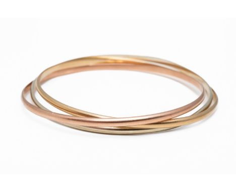 A GOLD TRI-COLOUR RUSSIAN STYLE BANGLEIn 9ct gold, inside diameter 63mm, gross weight 20 gramsCONDITION REPORTBangles are in 