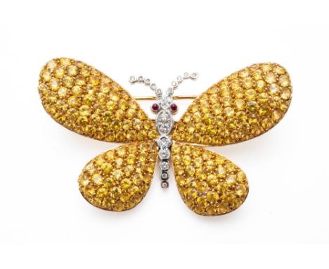 A YELLOW SAPPHIRE AND DIAMOND BUTTERFLY BROOCHThe wings set with round cut yellow diamonds and the thorax set with diamonds, 