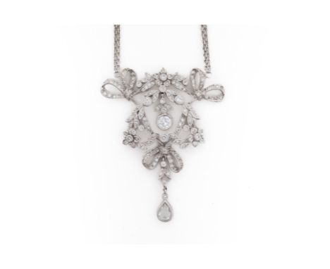 AN OPENWORK DIAMOND PENDANT NECKLACEWith a floral, foliate and ribbon motif pendant set with round brilliant diamonds and a p