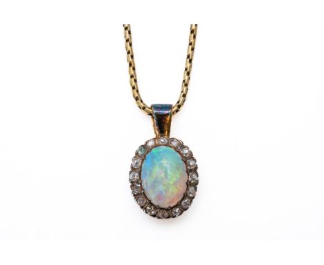 AN OPAL AND DIAMOND PENDANT NECKLACEWith a central oval cabochon opal, measuring 10.1mm x 7.5mm, in a surround of old cut dia