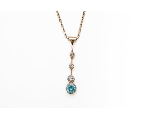 A ZIRCON AND DIAMOND PENDANT NECKLACEWith a drop pendant bezel set with three graduating old cut diamonds and a round cut zir