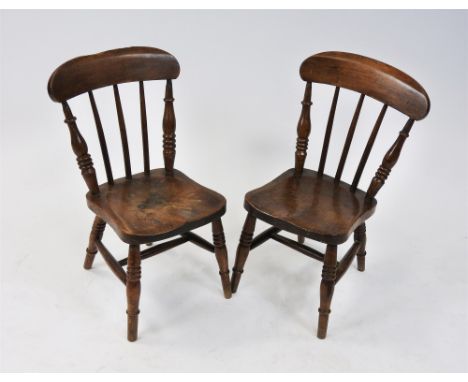 A pair of children's beech framed kitchen chairs, late 19th century, each with bar and stick back between triple ring turned 