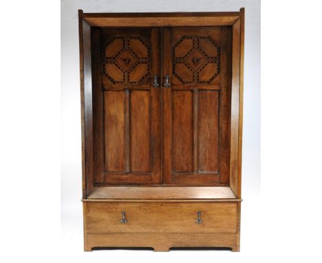 A late Victorian Scottish style oak and inlaid Arts and Crafts bedroom suite comprising a double door wardrobe with canted co