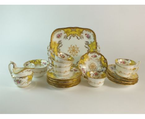 A Coalport yellow batwing tea service circa 1900, comprising six teacups, six saucers, six sideplates, cream jug, sugar bowl 