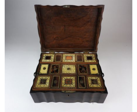 An Anglo Indian coromandel and ivory inlaid work box, mid 19th century, the shaped rectangular top inlaid with an elephant wi