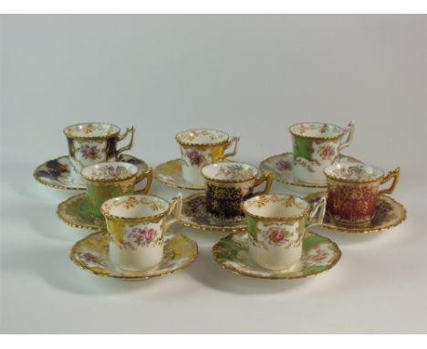 A matched Coalport demitasse coffee service, comprising eight cups and and saucers, in green, yellow, red and cobalt colourwa