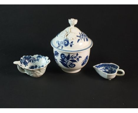 Three pieces of Worcester blue and white porcelain circa 1775-85, comprising a sucrier and cover in the Three Flowers and But