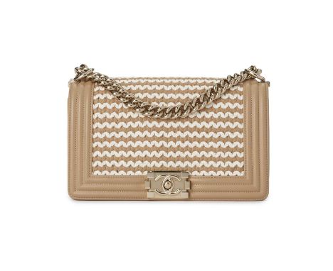 Chanel, a braided Medium Boy handbag, designed with a beige and white woven leather exterior and beige ribbed border, with po