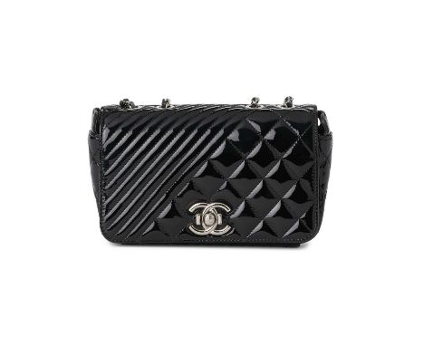 Chanel, a Small Coco Boy Flap handbag, featuring a quilted black patent leather exterior, with polished silver-tone hardware,