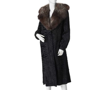 A Karakul Persian lamb wool coat, featuring hook and eye clip fastenings, fitted cuffs, a silver fox fur collar, two outer po