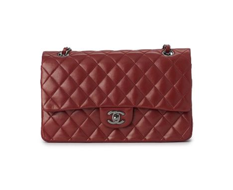 Chanel, a red Medium Classic Double Flap handbag, designed with a quilted red lambskin leather exterior, polished gunmetal ha