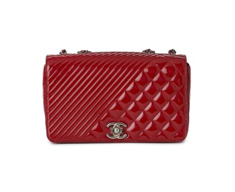 Chanel, a Medium Coco Boy Flap handbag, featuring a quilted red patent leather exterior, with polished silver-tone hardware, 