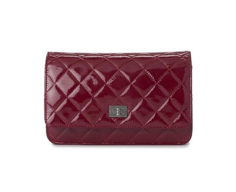 Chanel, a Reissue Wallet On Chain handbag, crafted from diamond quilted pink patent leather, featuring the maker's mademoisel