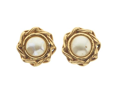 Chanel, a pair of clip-on earrings, featuring an imitation pearl at the centre and a gold-tone linked surround, signed Chanel