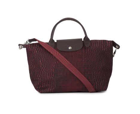 Longchamp, a Le Pliage crossbody handbag, designed with a crocodile printed purple nylon exterior, with grained leather top h