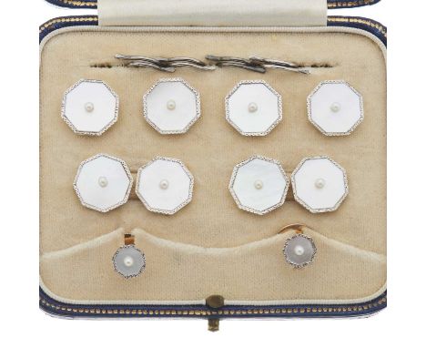 An 18ct and 9ct gold mother-of-pearl and seed pearl dress stud set, stamped 18ct 9ct, length of cufflink and button faces 1.3