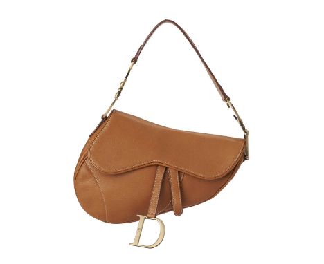 Christian Dior, a leather Saddle handbag, crafted from caramel leather, featuring a flat shoulder strap with brushed gold-ton