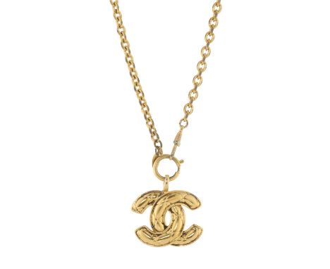 Chanel, a vintage 1980s gold-tone quilted CC pendant, comprising an oval-link chain necklace suspending the maker's iconic qu