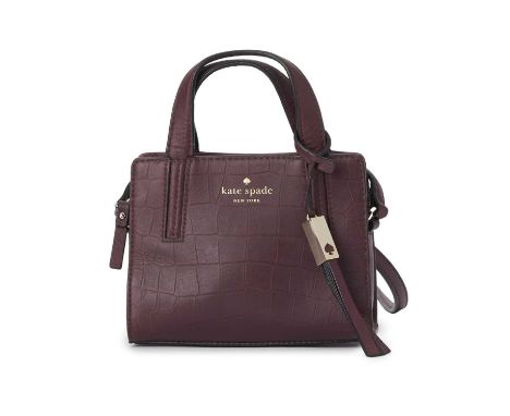 Kate Spade, a small embossed handbag, designed with a burgundy crocodile embossed leather exterior, dual top handles and a cr