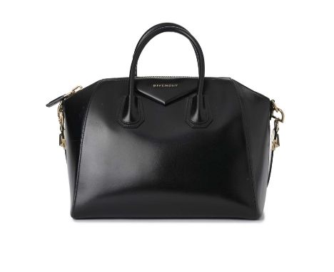 Givenchy, an Antigona handbag, designed with a smooth black leather exterior, with a triangular patch featuring the maker's l