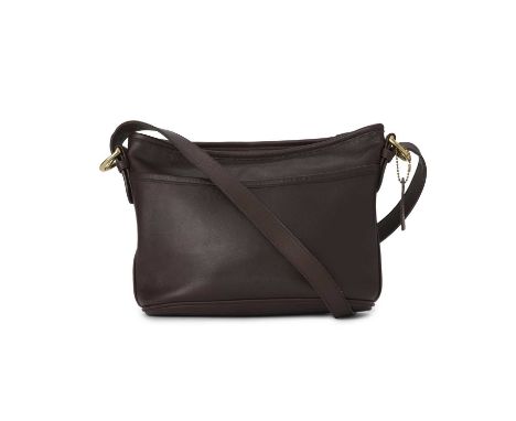 Coach, a vintage leather crossbody handbag, crafted from mahogany brown leather, featuring a front slip pocket, adjustable le