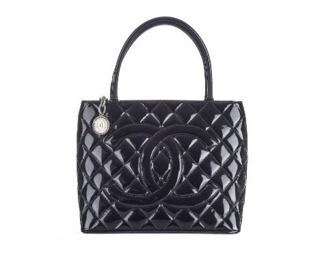 Chanel, a Timeless Medallion tote, crafted from black patent leather with the maker's classic diamond quilting and large appl
