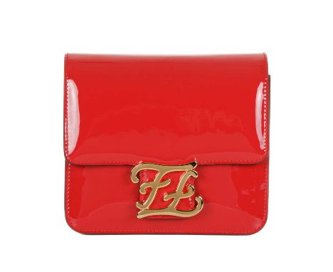 Fendi, a Karligraphy patent leather handbag, designed with a cardinal red patent leather exterior, with polished gold-tone ha