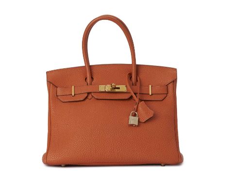 Hermes, a 2004 Birkin 30 handbag, designed with a grained orange leather exterior with gold-plated hardware, dual rolled hand