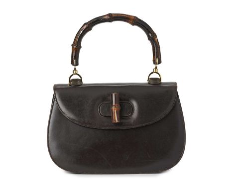 Gucci, a vintage Bamboo Top Handle handbag, crafted from smooth brown leather, featuring a curved bamboo top handle, a bamboo