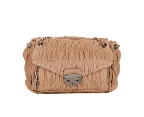 Prada, a Gaufre leather handbag, featuring a gathered beige leather exterior with polished silver-tone hardware, with two lar