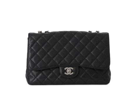 Chanel, a Jumbo Classic Flap handbag, featuring a black caviar quilted leather exterior, with polished silver-tone hardware, 