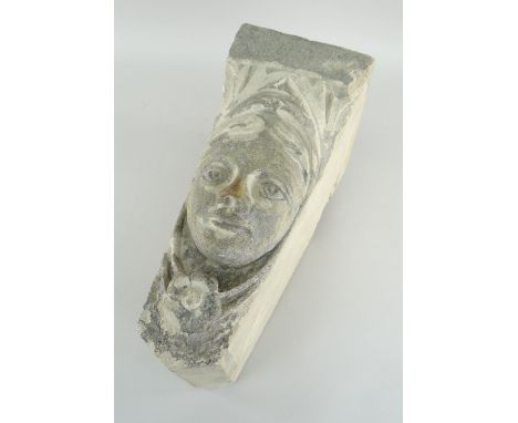 ARCHITECTURAL KEYSTONE carved with the face of a woman in the medieval style