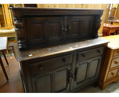 ERCOL CUPBOARD in the reproduction Elizabethan style, stained oak