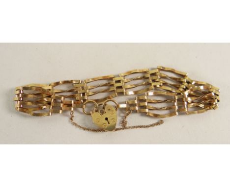 9CT GOLD FOUR BAR GATE BRACELET WITH HEART SHAPED PADLOCK, 7.1 grams.