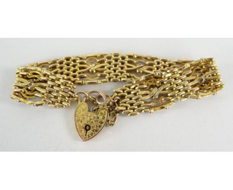 9CT YELLOW GOLD GATE LINK BRACELET with florally engraved heart shaped padlock, 12.1gms overall