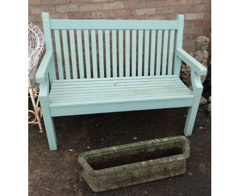 GREEN SLATTED GARDEN BENCH, makers label behind, 1 meter 20cms, and an Art Nouveau style stone trough, 82cms