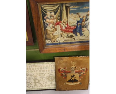A VICTORIAN ROSEWOOD FRAMED NEEDLEPOINT PICTURE OF CLASSICAL FIGURES, A FINELY WORKED ALPHABET SAMPLER AND AN ARMORIAL PANEL.