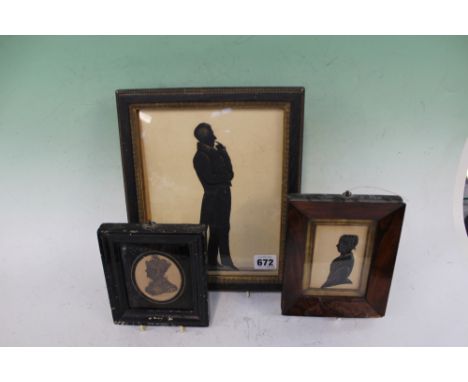 A VICTORIAN FULL LENGTH PORTRAIT SILHOUETTE OF A GENTLEMAN, WITH GILT HIGHLIGHTS AND TWO OTHER HALF LENGTH PORTRAITS OF LADIE