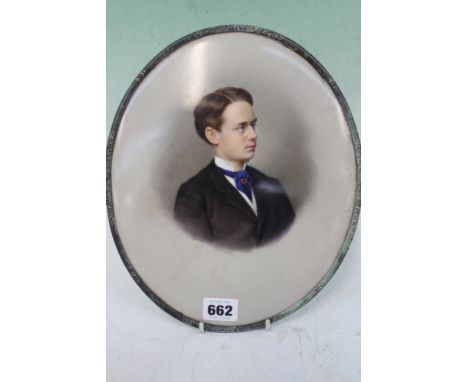 AN UNUSUAL GERMAN K.P.M.OVAL PORCELAIN PORTRAIT OF A YOUNG MAN WITH IMPRESSED MARK