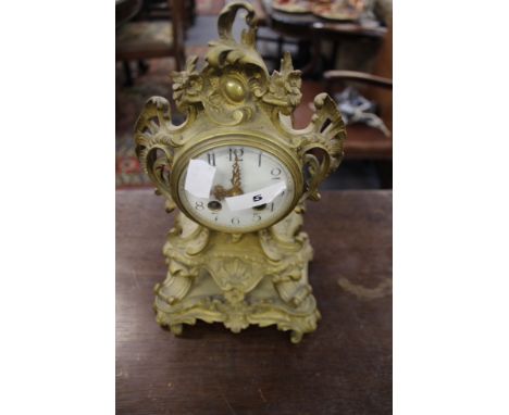 A VICTORIAN GILT BRASS ROCOCO STYLE STRIKING MANTLE CLOCK