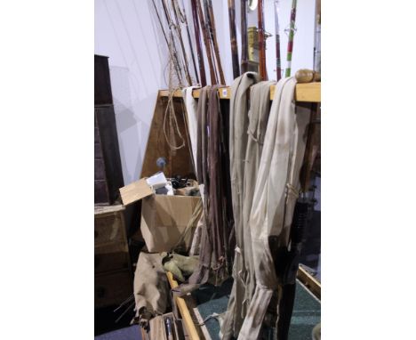 AN INTERESTING COLLECTION OF VARIOUS VINTAGE SPLIT CANE AND OTHER FISHING RODS, NUMEROUS FISHING REELS TO INCLUDE A HARDY BRO