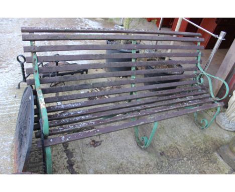 AN EARLY 20TH.C.WROUGHT IRON AND WOOD GARDEN BENCH.