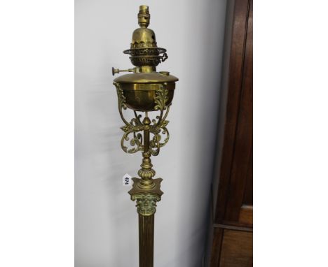 A LARGE BRASS CORINTHIUM COLUMN STANDARD LAMP