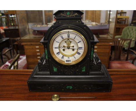A VICTORIAN BLACK SLATE AND MALACHITE INSET STRIKING MANTLE CLOCK